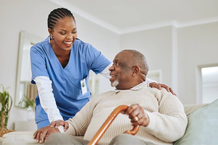 Caring professional with elderly client